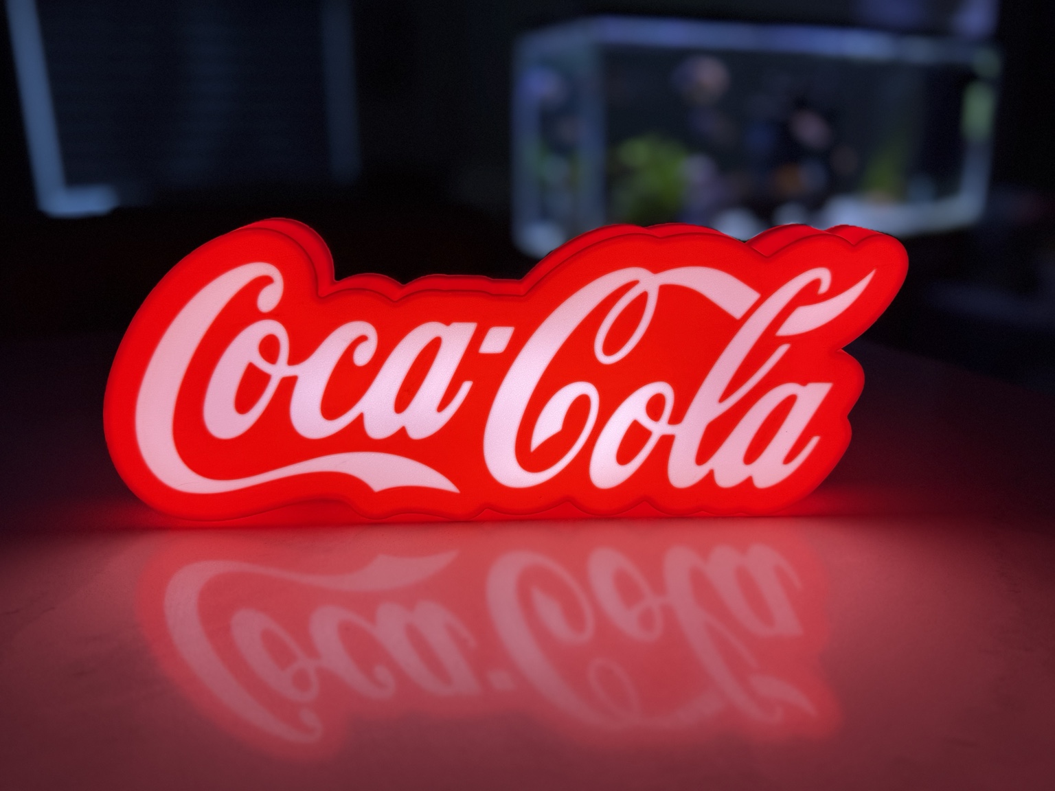 Red Coca-Cola script illuminated lightbox