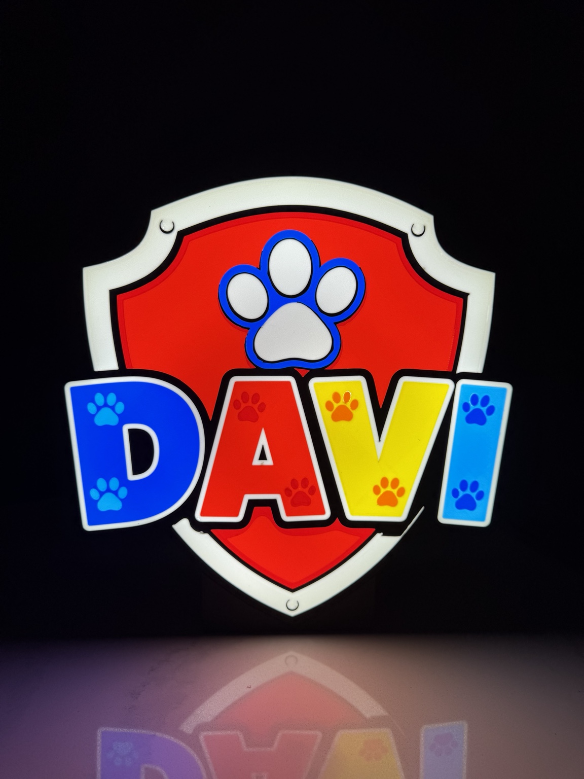 Colorful Davi name lightbox with paw print and shield