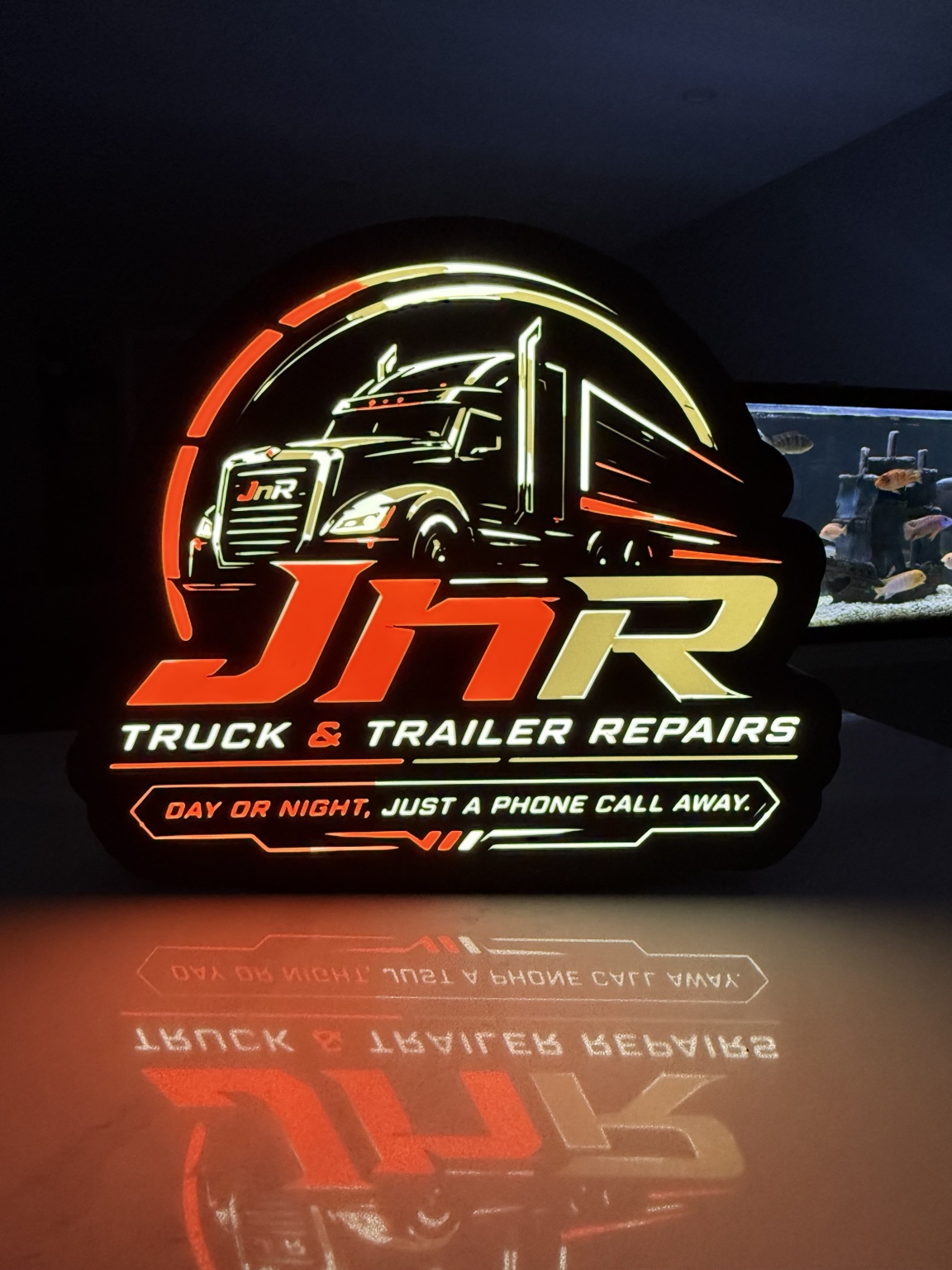 JnR Truck and Trailer Repairs lightbox with an illuminated transport truck
