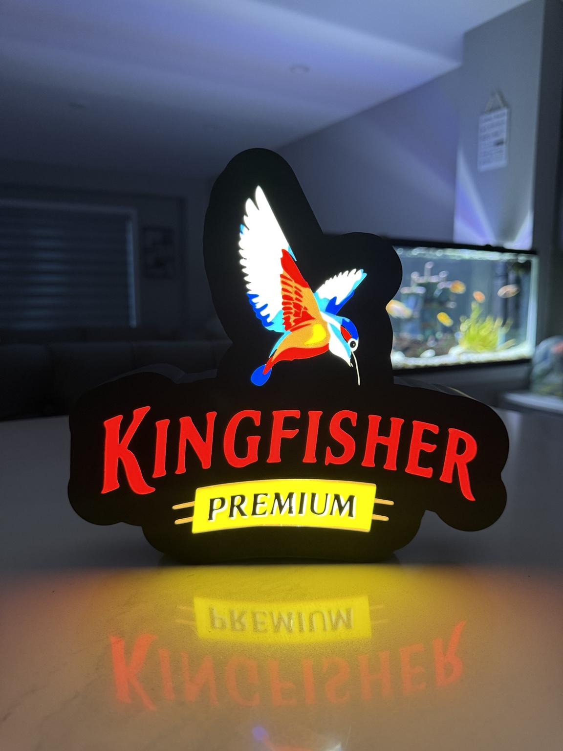 Kingfisher Premium illuminated lightbox with colorful bird graphic