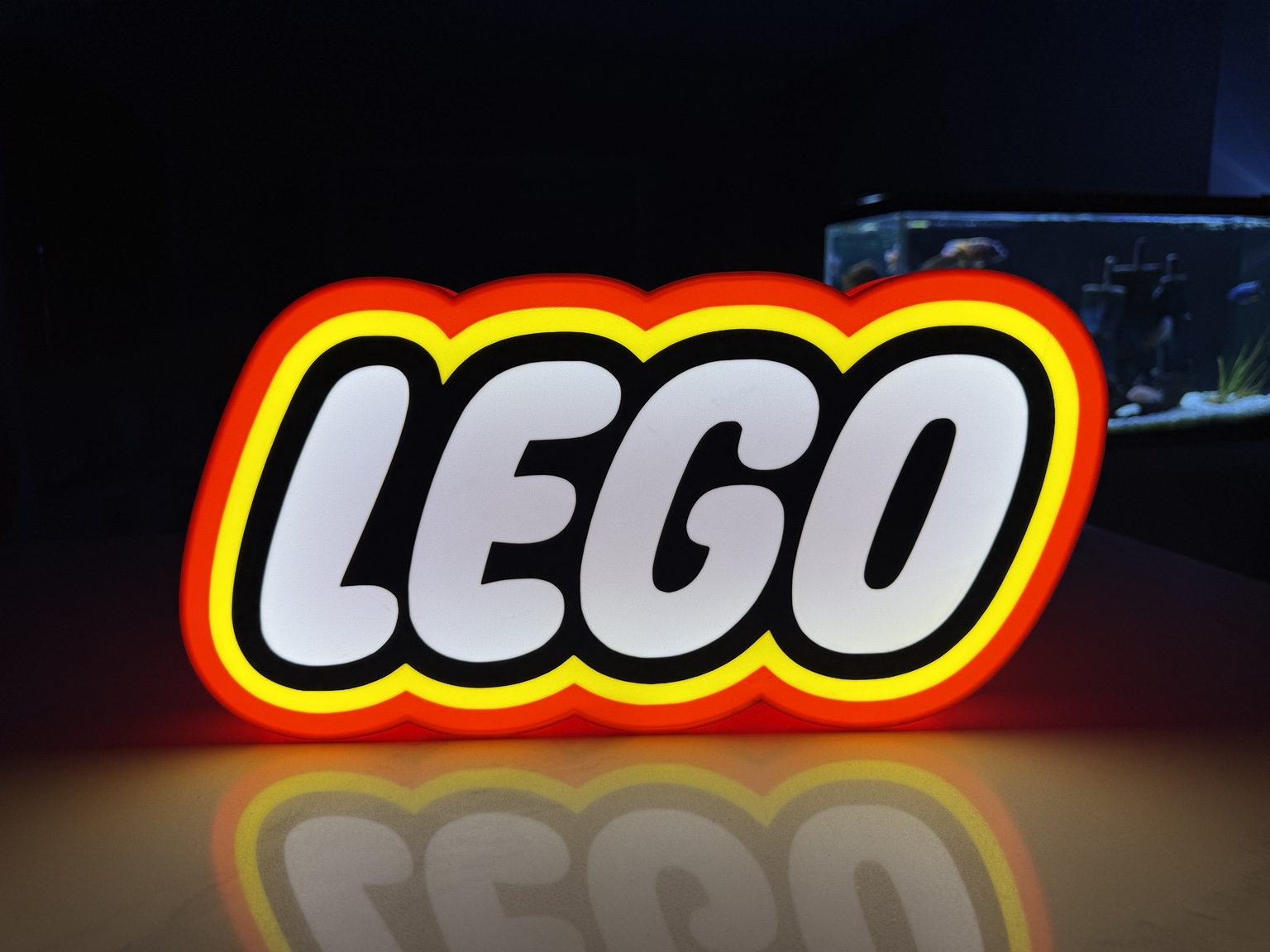 LEGO logo lightbox with white lettering and red and yellow border