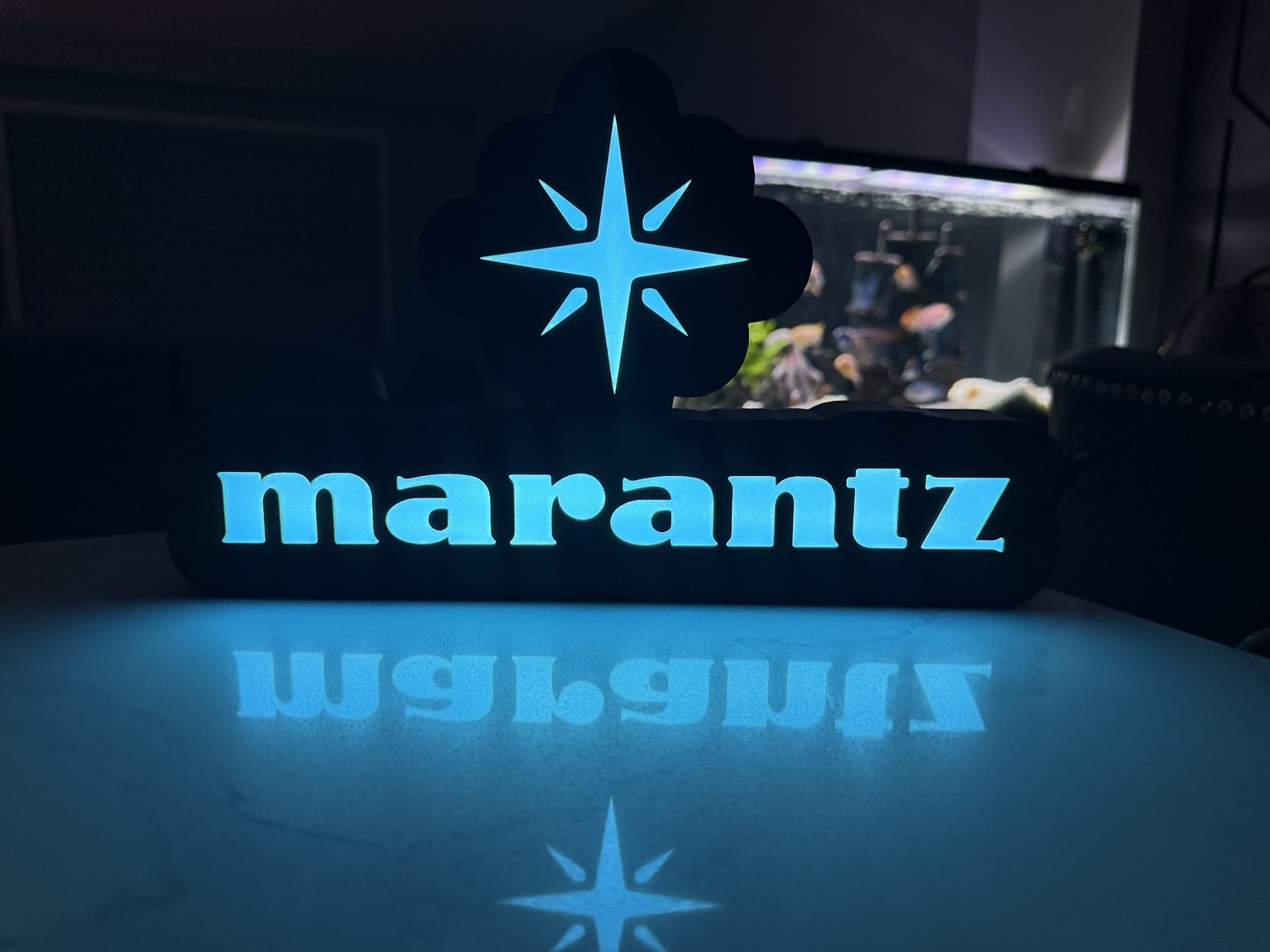 Cyan Marantz illuminated lettering with star symbol