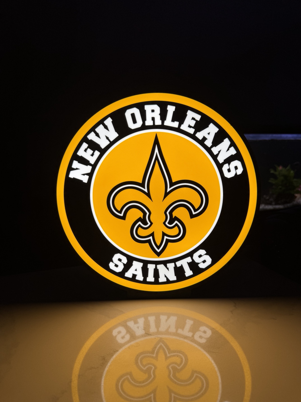 New Orleans Saints themed circular black and gold lightbox