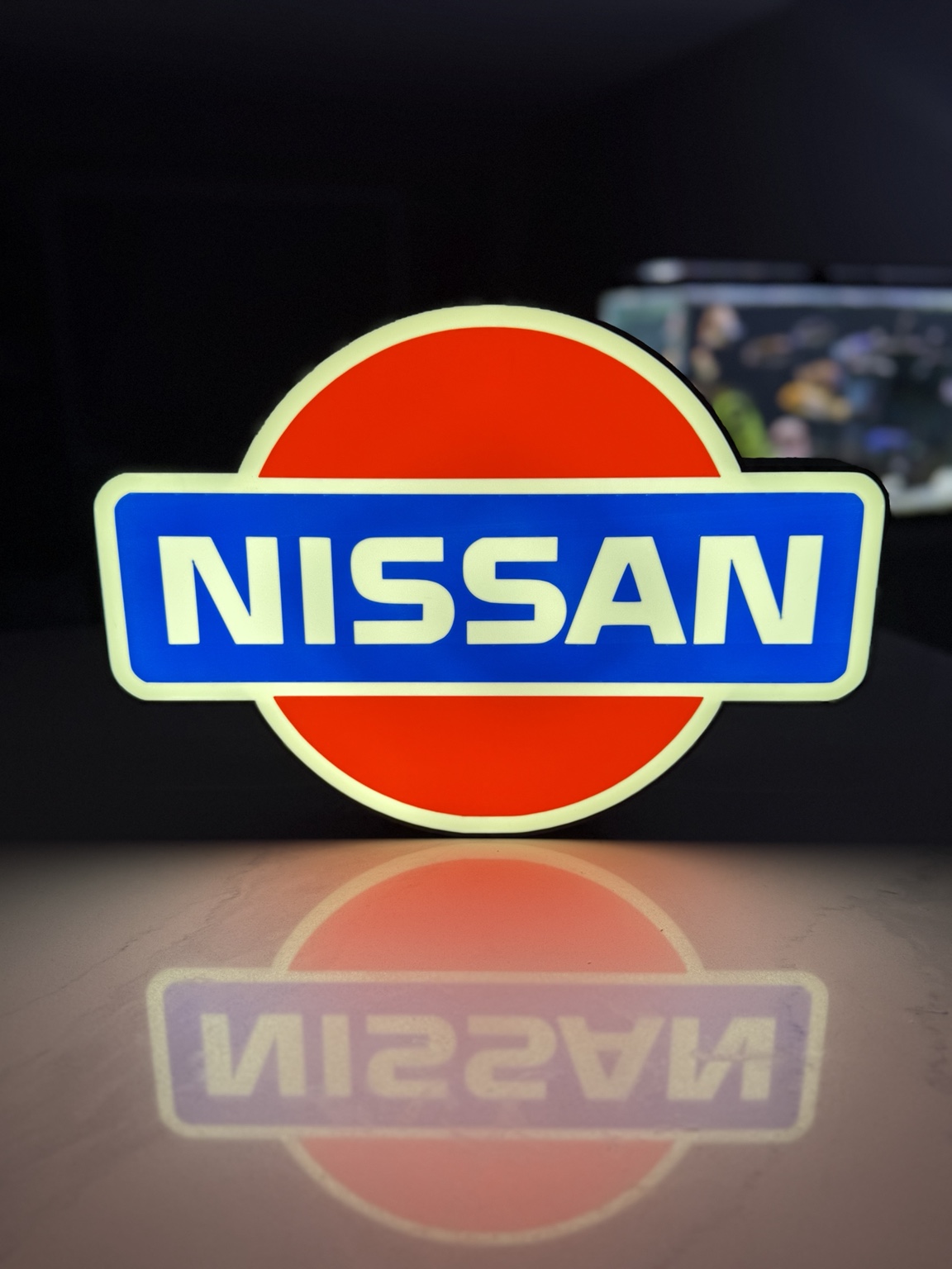 Nissan red white and blue emblem illuminated lightbox