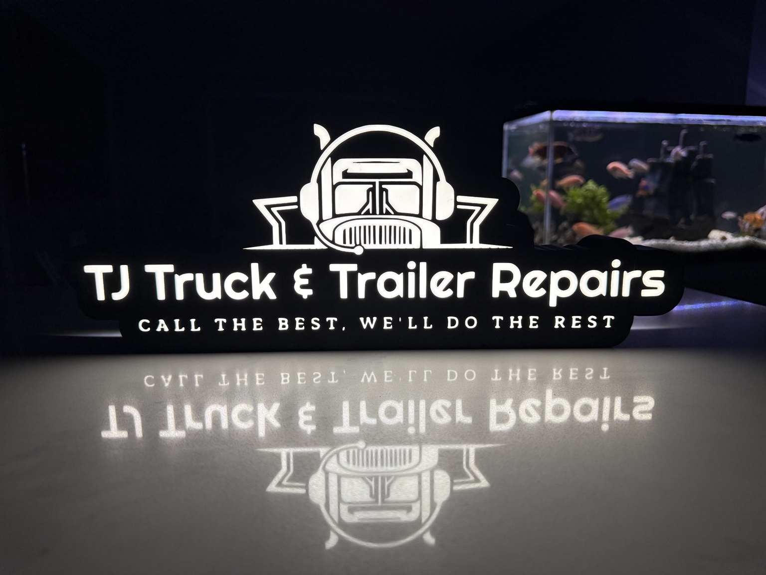 White TJ Truck and Trailer Repairs lightbox with truck graphic
